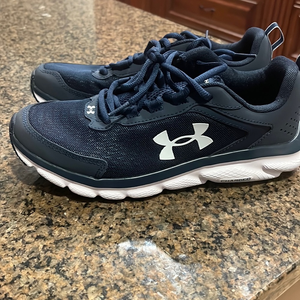 Men’s size 7 UA shoe. Worn once! Navy blue with white sole.